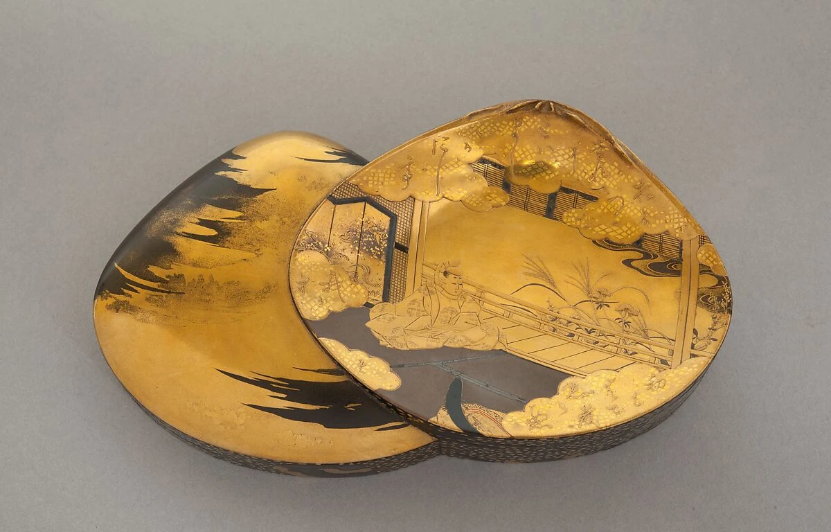 Actual gold-lacquer incense box and its lid, shaped as interlocking shells and decorated with a scene from The Tale of Genji.