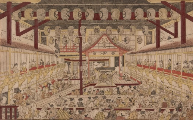 Masanobu’s perspective print shows a roofed stage deep in a theatre, crowded floor and galleries along both sides, with a passage extending into the audience.
